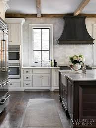 Traditional Door Style White Painted Cabinets Medium To Dark Stained Wood Island Fun Vent Hood Dark Textured Flooring Kitchen Design Home Kitchens Home