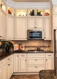 Wide planks of white beadboard make a charming backdrop for a collection of white china, creating the perfect fusion of rustic delicacy. Pin By Bea Thomas On My Beautiful Collections Antique White Kitchen Cabinets Antique White Kitchen Kitchen Cabinet Design