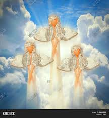 Angel over blue sky with rays of sun light. Three Angels On Heaven Image Photo Free Trial Bigstock