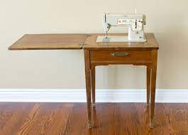 If that doesn't work out,you may not be able to drop the machine down into your cabinet,but, you can easily sew. Turn A Sewing Table Into A Bar Cart Chica And Jo