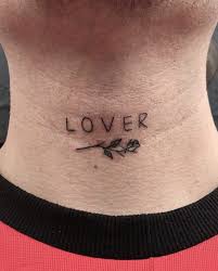 A Word Lover Is Inked In The Minimalist And Small Font On The Front Of The Neck Together With A Tin Tattoos For Lovers Small Neck Tattoos Neck Tattoos Women
