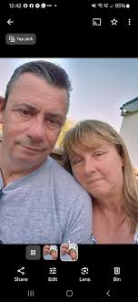 Hi can I keep our own faces but could you make angel wings around this so  that it makes my husband look like he is protecting me plz but keep  original faces