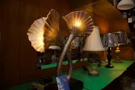 For overhead lighting above the accent chair, think about going with an arc lamp. Lighthouse Lighting Lamps Lighthouse District