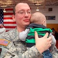 Staff Sgt. Richard Webekind hugs his son as families