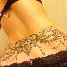 The floral design has been crafted in an amazing manner which covers the shoulder area and then runs in a cluster form till the lower back. 104 Hot Lower Back Tattoos Tramp Stamp Tattoos