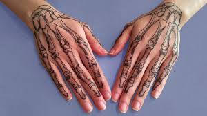 How much to small tattoos cost. 20 Skeleton Hand Tattoos That Are Terrifying And Cool The Trend Spotter