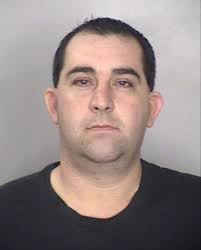 Detective probed for defending child molester