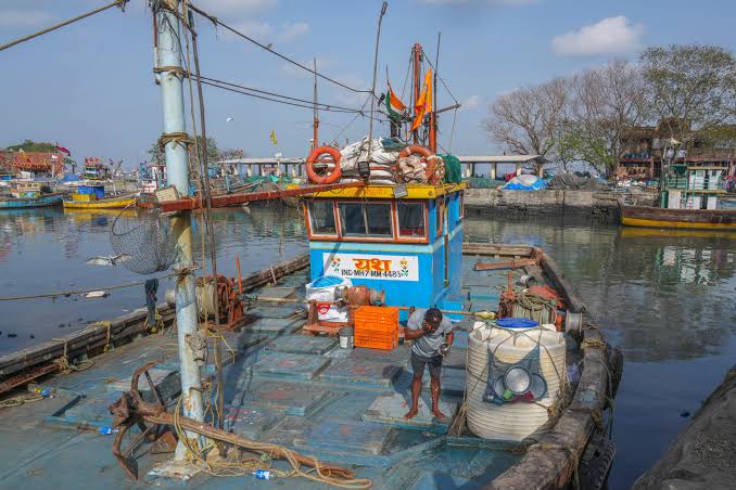 Photos show boats sitting idle at Mumbai's historic dock as the Iran war drives up fuel costs | The Independent