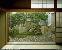 Stock Image View Through Picture Window To Trees And Rocks Set In Gravel In Contemporary Japanese Style Garden B Zen Garden Japanese Garden Landscape Design