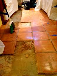Removal Of Aging And Damaged Saltillo Tile To Refresh The Floors Prior To Installation Of New Cabinetry It Makes A L Saltillo Tile Floor Saltillo Tile Flooring