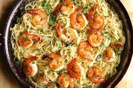 This succulent shrimp shines in this easy lemon, butter, garlic sauce recipe with a hint of white wine! Shrimp Scampi With Pasta Recipe The Hungry Hutch
