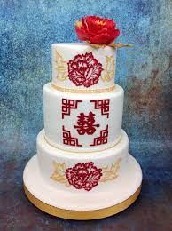 Add a simple, modern twist to a wedding cake with the mr. A Beautiful Oriental Design Featuring Stunning Brush Embroidery Detail Wedding Cake Oriental Wedding Cake Chinese Wedding Cake London