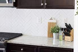 Price factors include tile size, material type, finish, pattern, size of the area covered, and your contractor's fees. Herringbone Subway Tile Backsplash Reveal Herringbone Subway Tile Backsplash Herringbone Subway Tile Tile Backsplash