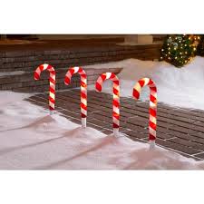 With 1m length between each marker and lit with 10 white leds per path light. Lightshow Colormotion Christmas Candy Cane Pathway Stakes 4 Count 118703 The Home Depot