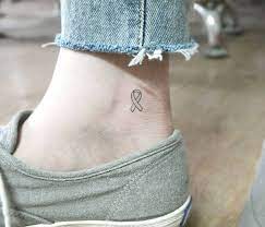 Pink ribbon tattoos symbolize breast cancer awareness. Pin On Tattoos