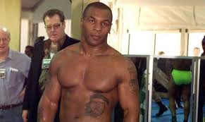 Among the many celebrities who are prominently tattooed, mike tyson's tattoos are particularly interesting. Mike Tyson Che Guevara Sur Les Cotes Mao Zedong Sur Le Bras Un Tribal Sur Le Visage Quelles Significations Derriere Ses Tatouages Les Plus Fous Photos