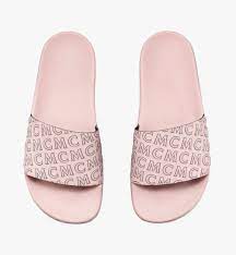 White circle outlined in black with upwards pointing arrow in center. 40 It Women S Diagonal Monogram Rubber Slides Pink Mcm Us