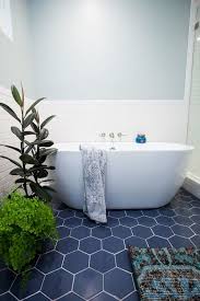 Master Bathroom Renovation Before After The Effortless Chic Master Bathroom Renovation Tile Bathroom Bathroom Floor Tiles