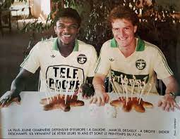 In the photo in question, the coach of the france team and the young man pose in a swimsuit with a loved one in front of a swimming pool. Old School Panini On Twitter October 1986 Two Young Fellas Marcel Desailly Didier Deschamps