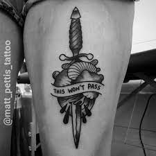 Dagger tattoos are not only a symbol of courage but also people choose to go for dagger heart tattoos to remind themselves of past betrayal or treachery, leaving them heartbroken or hurt. Black Heart And Dagger Tattoo On Thigh By Matt Pattis Tattooimages Biz
