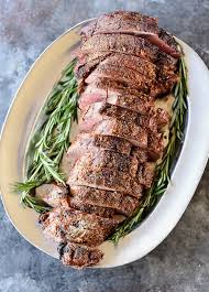 Wrap bacon slices around tenderloin and rosemary to enclose tenderloin completely. Beef Tenderloin Recipe Add A Pinch