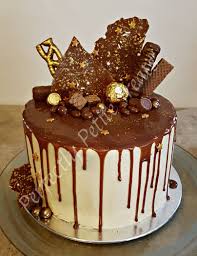 Chocolate Drip Cake Four Layers Of Chocolate Cake Covered With Caramel Buttercream Drizz Chocolate Cake Decoration Chocolate Drip Cake Chocolate Caramel Cake