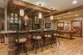 Plus everything is wood and more rustic than you might think. Queensland Lane Basement Finished Basement Company Rustic Basement Basement Remodeling Basement Bar Designs