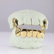 Our solid gold collection of grillz is completely plated with 10k, 14k and 18k gold. Solid Gold Grillz Dayyani Jewelers
