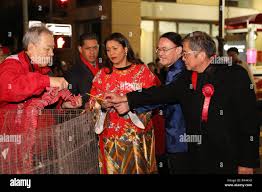San Francisco, USA. 23rd Feb, 2018. San Francisco Mayor London Breed (C)  lights firecrackers accompanied by Chinese Consul General in San Francisco  Wang Donghua (2nd, R) and President of the San Francisco