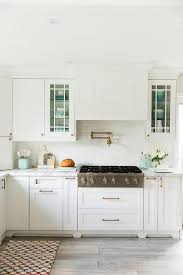White Kitchen With Drawers Under Cooktop Blue Kitchen Accents Kitchen Renovation Diy Kitchen Renovation