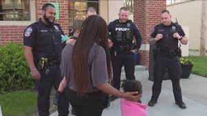 IMPD officers reunite with mom and her two kids they saved from fire |  wthr.com