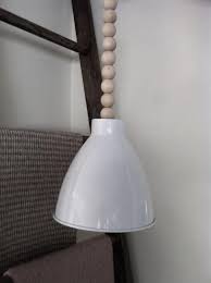 Diy Lamp Cord Of Wooden Beads Remodelista Lamp Cord Diy Pendant Light Pendant Light Cord