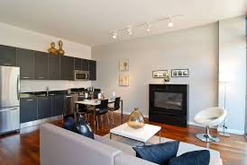A classic design trick to make a room look and feel larger is to add a mirror. Modern Living Room And Kitchen Design For Small Spaces