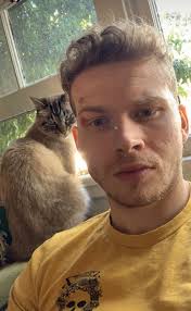 After seeing pictures of Oliver's cat, Norman, it's making me really want a  cat