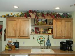 On my pinterest board kitchen styling there are lots of ideas. Decorating Above Kitchen Cabinets Before And After Pictures And Tips Joyful Daisy