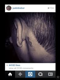 Check out our music note tattoos selection for the very best in unique or custom, handmade pieces from our shops. Justin Bieber Shows Off New Tattoo Behind His Ear His Fourth Inking This Year Daily Mail Online
