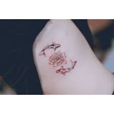 The fine dot work, as well as the shadows, look like they were carefully done. Feminine Two Koi Fish And Lotus Tattoo On The Side Small Tattoos Tattoos Trendy Tattoos