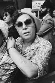 May24,1982. A Holocaust survivor shows her concentration camp identity  tattoo at the 'Salute To Israel' march. Photo by Jill Freedman/Getty Images