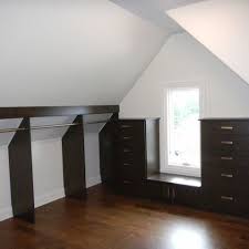 Amazing gallery of interior design and decorating ideas of sloped ceiling in bedrooms, closets, decks/patios, nurseries, dining rooms, bathrooms, laundry/mudrooms, kitchens, boy's rooms, entrances/foyers by elite interior designers. Storage Under The Eaves Slanted Ceiling Closet Attic Closet Closet Designs