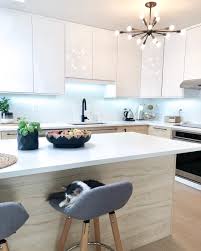 I'm working on some cabinets right now; Cozy On Up To The Combination Of Ikea S Askersund Ash And Ringhult High Gloss White Cabinetry In This M Ikea Kitchen Design White Modern Kitchen Modern Kitchen