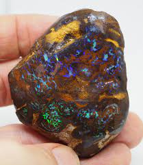 The cutter studies this rock and decides how to cut the best possible gem. 380 00ct Rough Queensland Matrix Boulder Opal Pj97