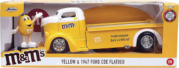 M&Ms 1947 Ford COE Flatbed & Yellow M&M Diecast Figure & Car (Pre-Order  ships October)