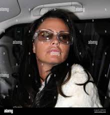 Katie Price leaves the Mayfair Hotel in her white Range Rover Sport and  matching white fur jacket separate from Alex Reid, London, UK, 04/20/10. B  Stock Photo