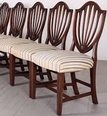 It is a stylish addition to any dining room with its classic french features and fine detailing. Biggs Set Of Eight Shield Back Sheraton Style Dining Chairs 1950s At 1stdibs