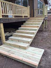 For The Stairs We Ran Three Stringer Each Step Is 5 5 Inches High The Size Of 1 Standard Deck Board And Rough Deck Stairs Patio Railing Deck Stair Stringer