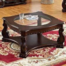 Generally the rule is that your coffee table should be the same height as your couch's seat (give or take one to two inches, but not any lower). Crown Mark Madison Traditional Cocktail Table With Glass Top Wayside Furniture Cocktail Coffee Tables