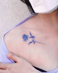 Rose tattoo is such a wonderful idea for all the women in the world if they want to have a floral tattoo. Micro Realistic Blue Rose Tattoo On The Collarbone