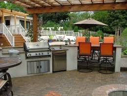 Jetzt ab 50€ portofrei bestellen! An Outdoor Kitchen And Island With Granite Countertops A Refreshment Station Refrigerator Outdoor Kitchen Countertops Outdoor Kitchen Outdoor Kitchen Design