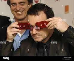Bono (foreground) and Bobby Shriver during a photocall to announce the  latest brand (Motorola) to join join Product (RED), at Carphone Warehouse, 