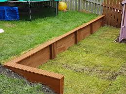 Retaining Wall Made From Scaffold Planks Backyard Patio Backyard Retaining Wall
